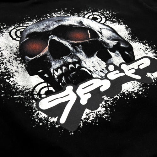 Close-up of the back graphic on the Life is Grim hoodie by KIBISHI — featuring a bold skull illustration with red-tinted eyes and graffiti-style text, printed on heavyweight French terry fabric.